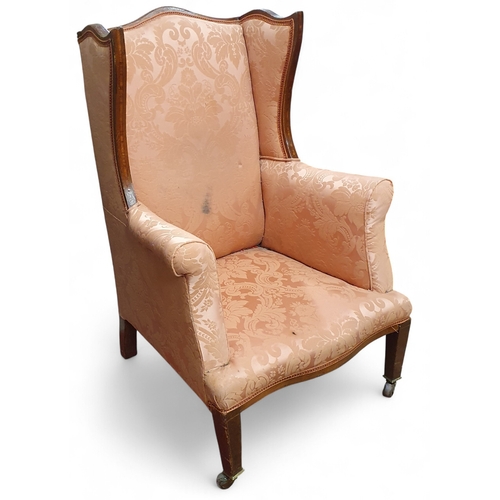 461 - An Edwardian Mahogany and inlaid wingback Chair on square tapered supports and castors.
W 70 x SH 29... 