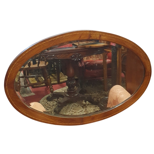 469 - An Edwardian Mahogany and Inlaid oval Mirror.
76 cm approx.