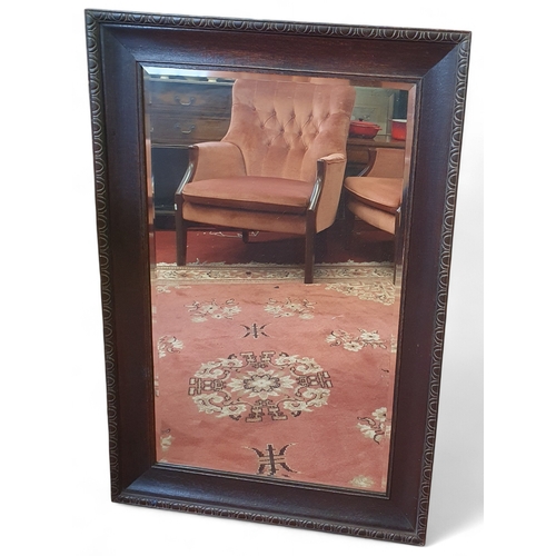 473 - An early 20th Century Oak rectangular Mirror with bevelled mirror glass. Of good size. 
H 97 x 66 cm... 