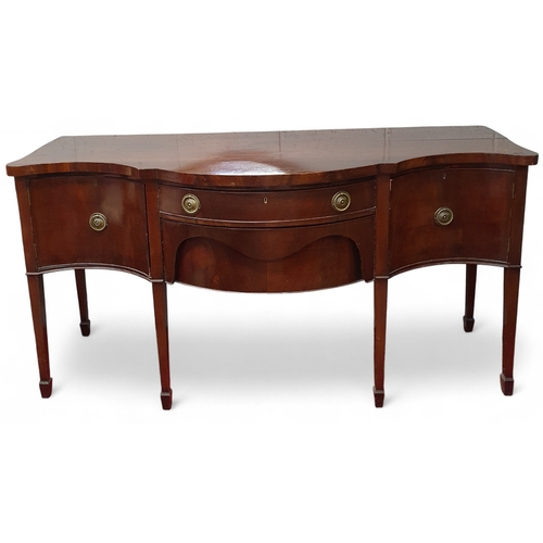 476 - A 19th Century Mahogany bow and serpentine fronted Sideboard on square tapered supports.
181 x 70 x ... 