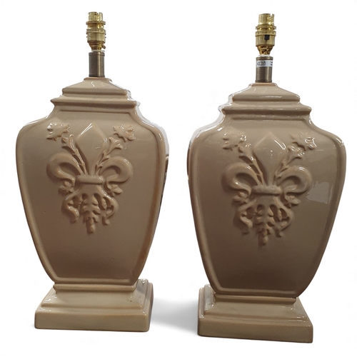 502 - A really good pair of beige ground Ceramic Table Lamps of large size with Fleur de Lis style embosse... 