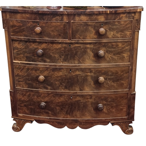 457 - A Victorian Mahogany bow fronted Chest of drawers with two short over three long drawers.