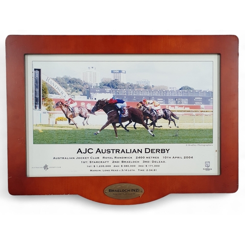 186 - A framed AJC Australian Derby 2004 Photograph where Starcraft ridden by Glen Boss. 43 x 48 cm approx... 