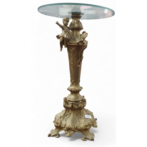 429 - A White Metal Centre Piece with Glass swivel top.
H 39 cms approx.