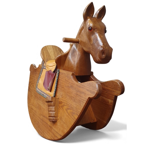 460 - An interesting 20th Century Oak Rocking Horse.
L 99 x H 77 cms approx.