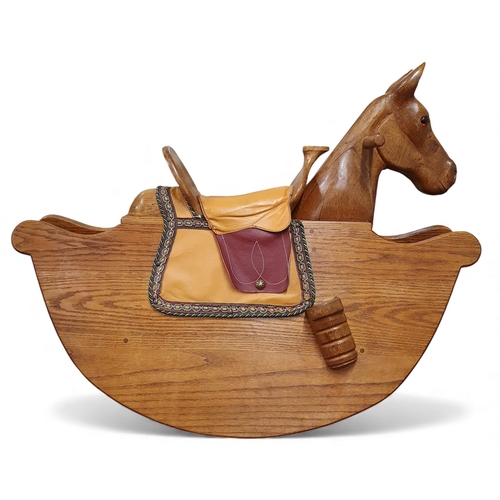 460 - An interesting 20th Century Oak Rocking Horse.
L 99 x H 77 cms approx.