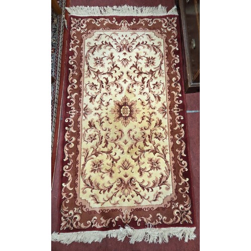 835 - A pair of red and cream ground Rugs.
88 x 171 cm approx.
