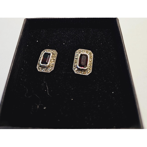 306 - A pair of Silver and Gem set Earrings.