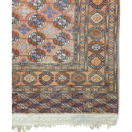 19 - A Red ground Carpet with multi borders and repeating central medallion design. 295 x 187  H 41 cm ap... 