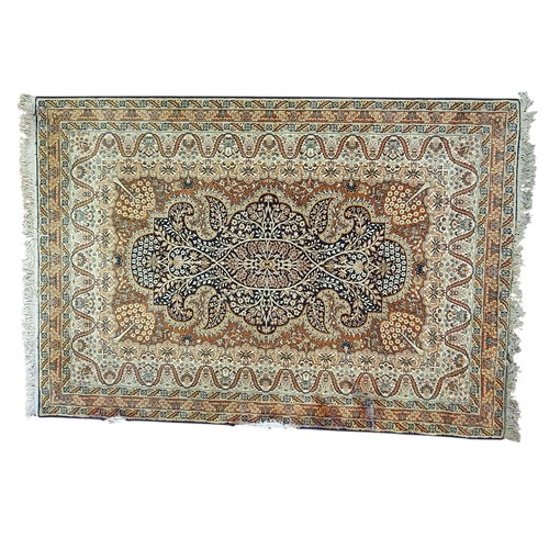 20 - A Cream ground Carpet with all over design and multi borders. 250 x 170.