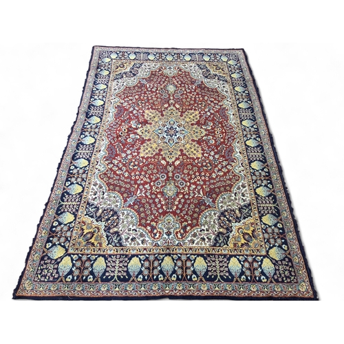 425 - Large Red ground rug with central floral medallion, floral field with hanging baskets, floral gradua... 