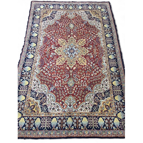 425 - Large Red ground rug with central floral medallion, floral field with hanging baskets, floral gradua... 