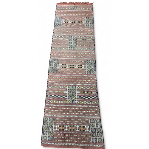 445 - An Iranian Kilim Runner. 275 x 80 cm approx.
