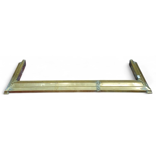 465 - An Art Nouveau Brass Fender. L 142 x 42 cm approx.