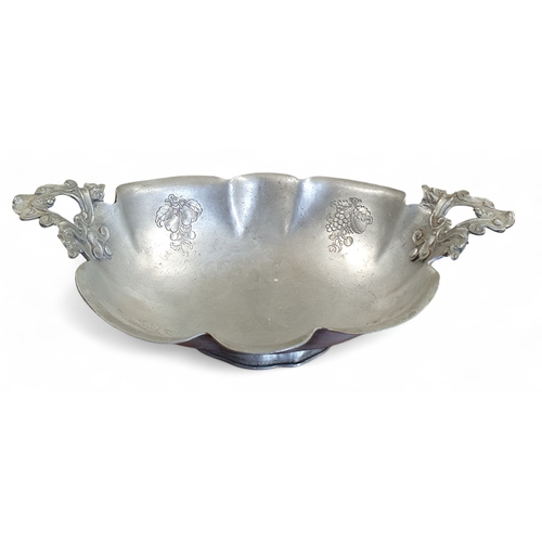 345 - A 19th Century Pewter Centre Dish with floral etching and foundry mark underneath. 40 x 23 cm approx... 