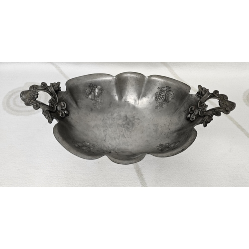 345 - A 19th Century Pewter Centre Dish with floral etching and foundry mark underneath. 40 x 23 cm approx... 