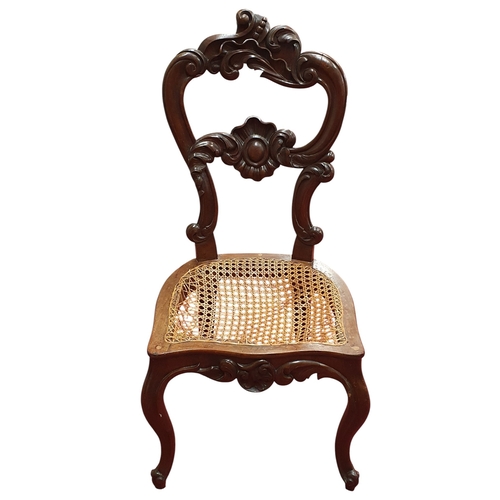 469 - A Pair of 19th Century Walnut Hall Chairs with canework seats along with a foot stool and a piano st... 