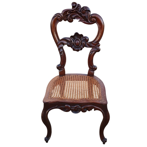 469 - A Pair of 19th Century Walnut Hall Chairs with canework seats along with a foot stool and a piano st... 