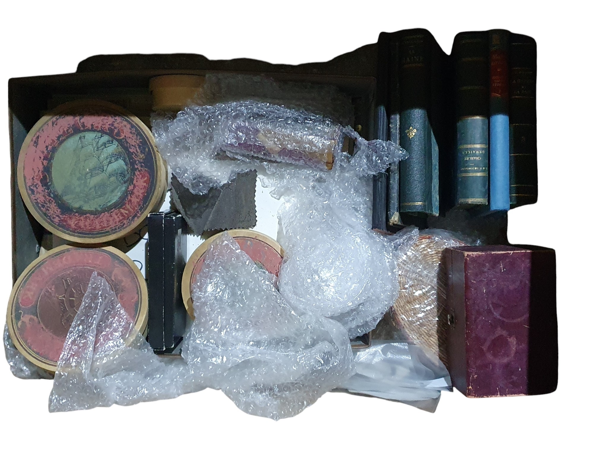 A large box of various Film Prop items.