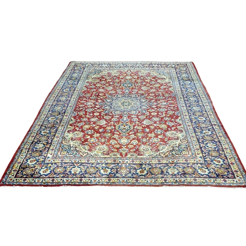 1 - An extremely large Persian Red ground Carpet with unique centre medallion and multi borders. 440 x 3... 
