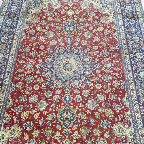 1 - An extremely large Persian Red ground Carpet with unique centre medallion and multi borders. 440 x 3... 