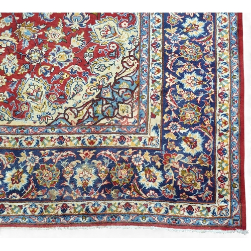 1 - An extremely large Persian Red ground Carpet with unique centre medallion and multi borders. 440 x 3... 