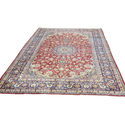 1 - An extremely large Persian Red ground Carpet with unique centre medallion and multi borders. 440 x 3... 