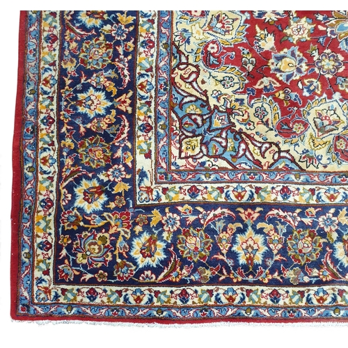 1 - An extremely large Persian Red ground Carpet with unique centre medallion and multi borders. 440 x 3... 