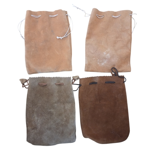 93 - Four leather reel Pouches along with a vintage leather case.