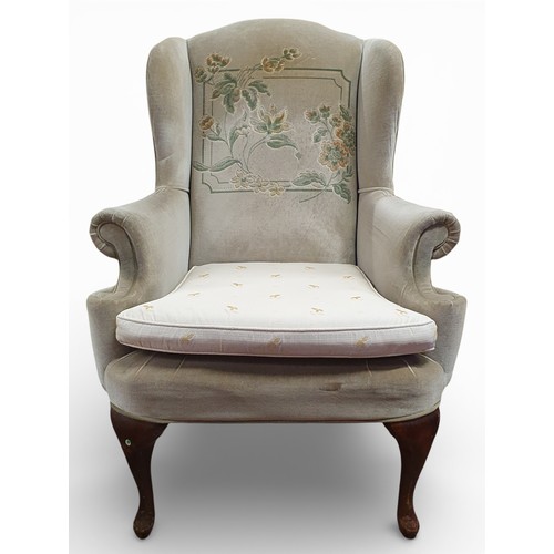 457 - An early to mid 20th Century Wingback Armchair on cabriole supports with green velvet upholstery. Wi... 