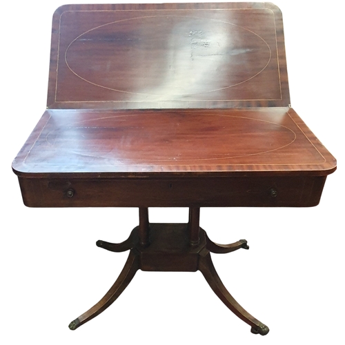 460 - A Regency Mahogany and Inlaid fold over Tea Table on splayed supports with brass castors.  91 x 92 x... 