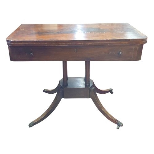 460 - A Regency Mahogany and Inlaid fold over Tea Table on splayed supports with brass castors.  91 x 92 x... 