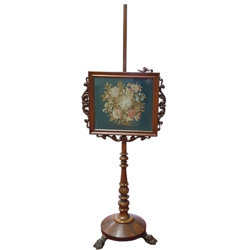226 - A William the Fourth Rosewood Pole Screen with Tapestry panel centre, on pedestal support and hairy ... 