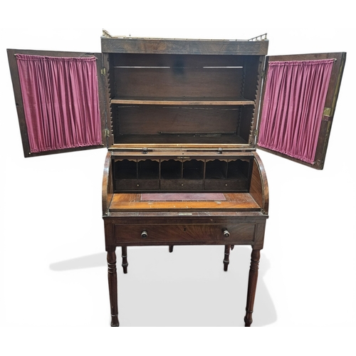 447 - A Regency Mahogany Cylinder Desk on turned supports with twin door gallery top. 78 x 54 x H 152 cm a... 