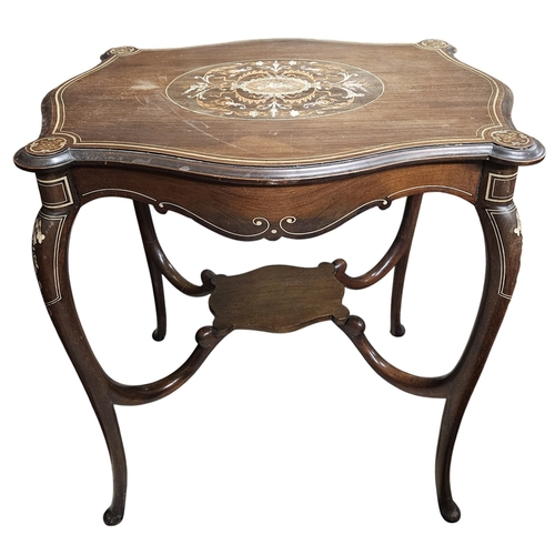 233 - An Edwardian Mahogany and Inlaid Centre Table with a highly inlaid top on cabriole supports and stre... 