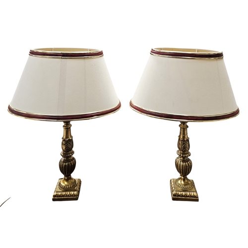 234 - A lovely pair of 20th Century Brass table Lamps with cream ground shades. H 34 cm approx.