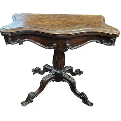 246 - A William IV Rosewood and Veneered foldover Card Table on reeded tulip supports and quatrefoil base.... 