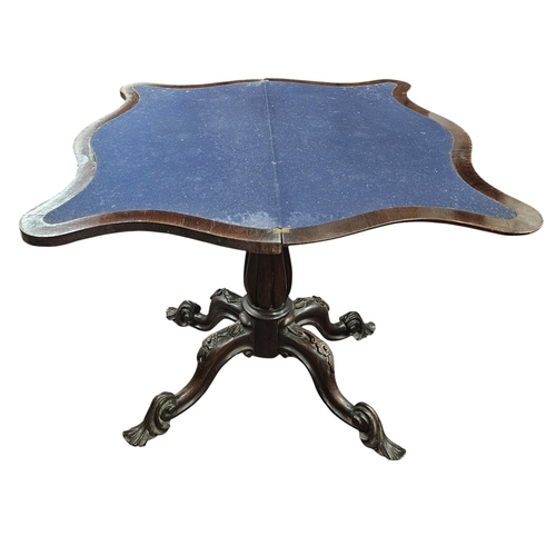246 - A William IV Rosewood and Veneered foldover Card Table on reeded tulip supports and quatrefoil base.... 