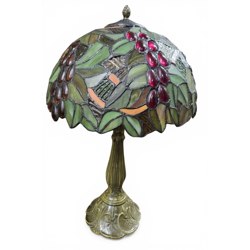 431 - A Tiffany design Lamp with floral motifs. H 46 cm approx.