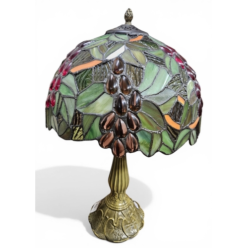 432 - A Tiffany design Lamp with floral motifs. H 46 cm approx.