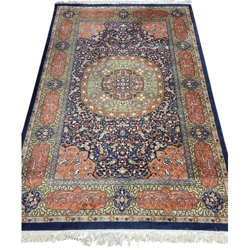 254 - A good Persian Blue ground Carpet, Arabic lettering border and central medallion design. 320 x 203 c... 