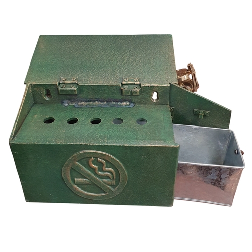 449 - An unusual Cast Iron wall mounted Cigarette Box  with lift up lid. W 24 x H 16 cm approx.