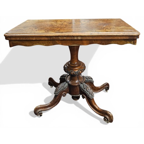 439 - A good mid 19th Century Walnut and Burr Walnut foldover Card Table on highly carved scissor pod.