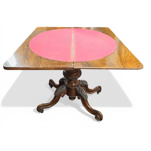 439 - A good mid 19th Century Walnut and Burr Walnut foldover Card Table on highly carved scissor pod.