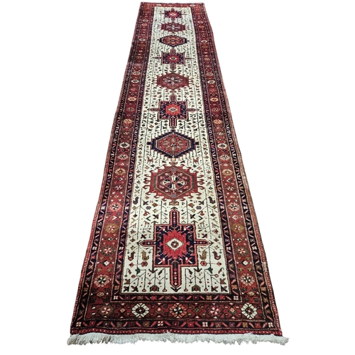 245 - An Ivory ground full wall pile Persian Tabriz Runner with repeating bespoke central medallion design... 