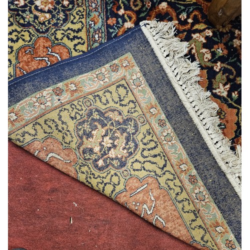 254 - A good Persian Blue ground Carpet, Arabic lettering border and central medallion design. 320 x 203 c... 