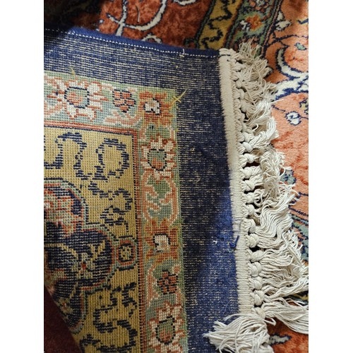 254 - A good Persian Blue ground Carpet, Arabic lettering border and central medallion design. 320 x 203 c... 