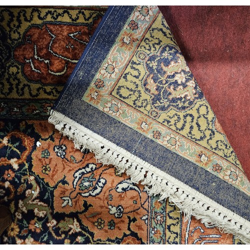 254 - A good Persian Blue ground Carpet, Arabic lettering border and central medallion design. 320 x 203 c... 