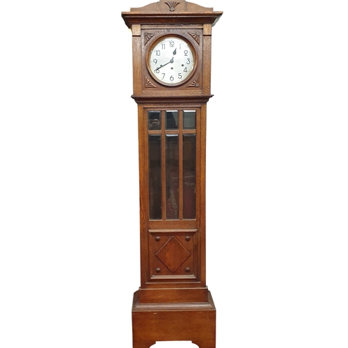 3 - A 20th Century Arts and Craft movement Oak silver dial Longcase Clock. W 45 x D 24 x H 175 cm approx... 