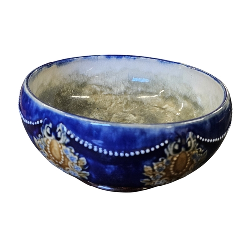 109 - A Doulton Lambeth blue ground salt glaze Bowl. D 20 x H 9 cm approx.